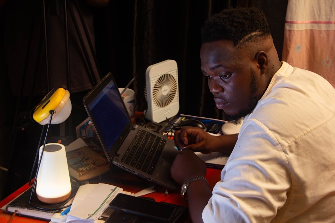 african entrepreneur working on laptop