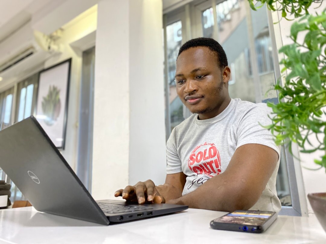 african entrepreneur working on laptop