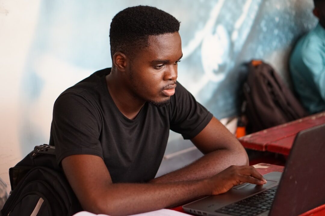 african entrepreneur using laptop